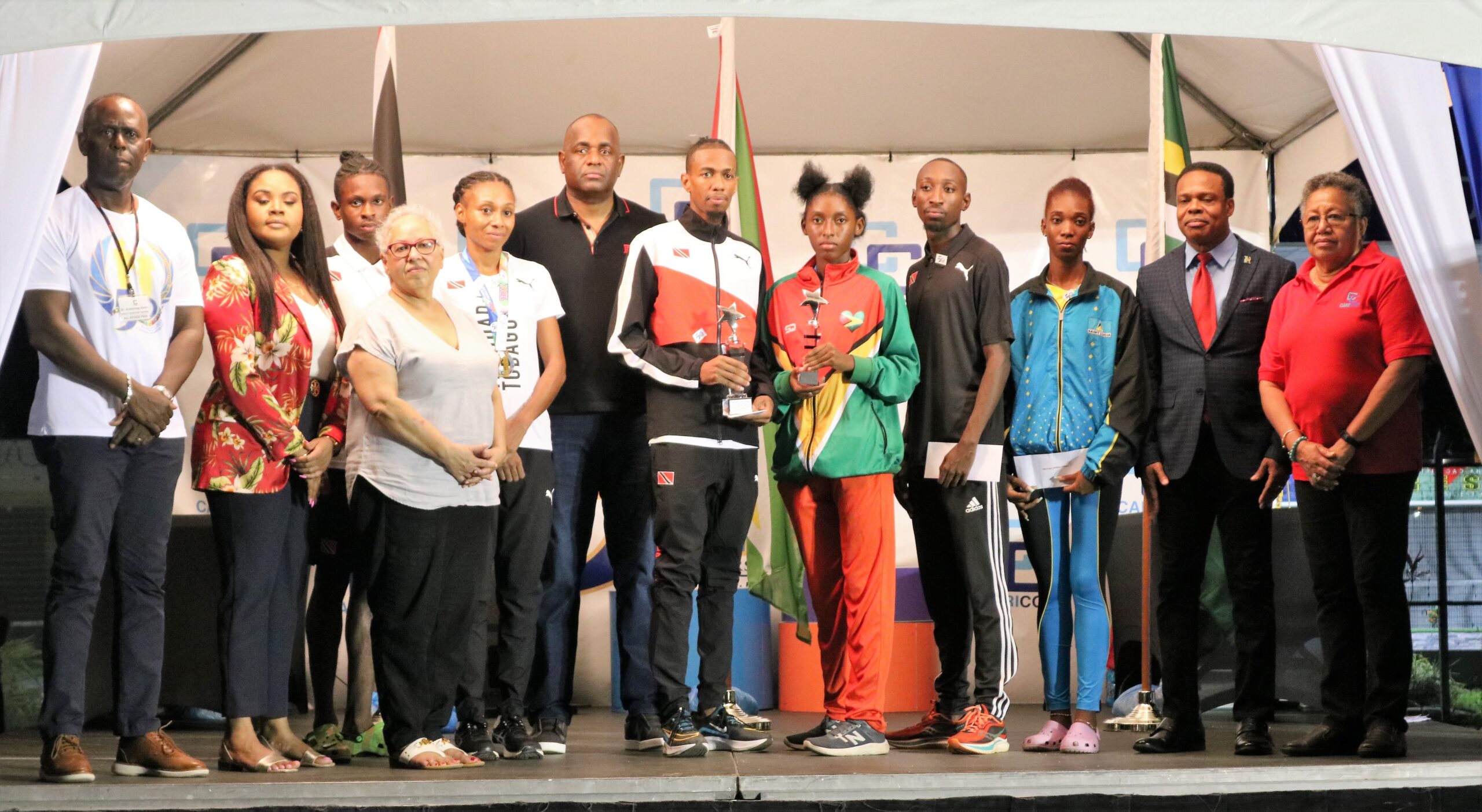 Road-races-Hon.-Roosevelt-Skerrit-with-16th-CARICOM-Road-Races-10K-winners-scaled