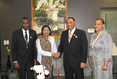 COSTA RICA – CARICOM Chairman, Prime Minister of The Bahamas Rt. Hon. Perry Christie (2nd right) greets Trinidad and Tobago’s Prime Minister Hon. Kamla Persad-Bissessar at the Third Summit of the Community of Latin American and Caribbean