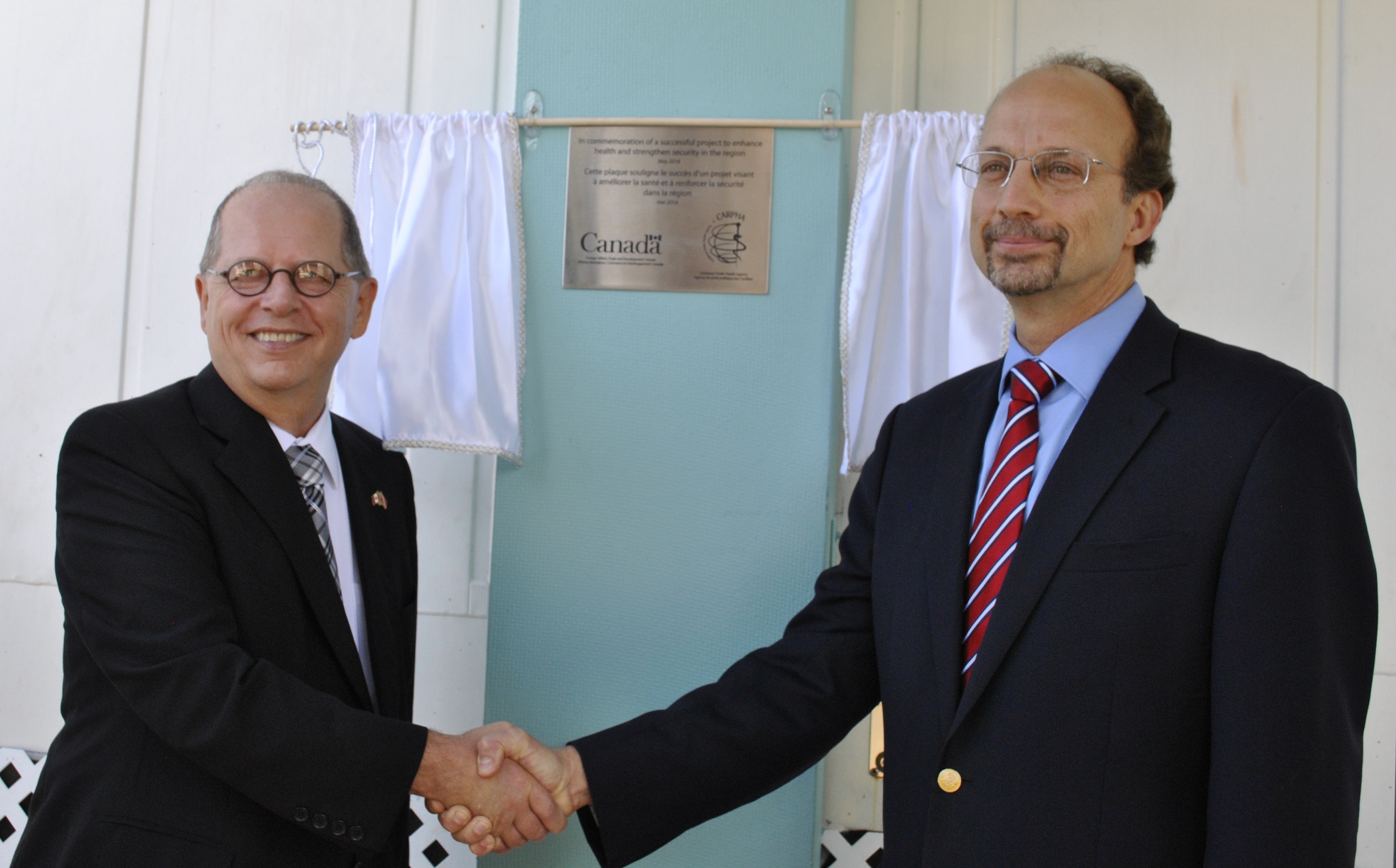 High Commissioner for Canada to Trinidad and Tobago, Gerard Latulippe hands over the new BSL-3 Laboratory to Executive Director, CARPHA, Dr. C. James Hospedales Left to Right: High Commissioner for Canada to Trinidad and Tobago, Gerard Latulippe;