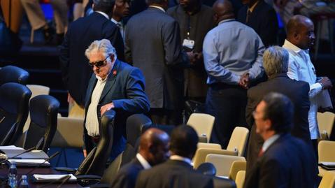 St. Kitts and Nevis' Prime Minister the Rt. Hon. Dr. Denzil L. Douglas speaks with counterparts from Grenada and St. Lucia at the meeting in Havana, Cuba