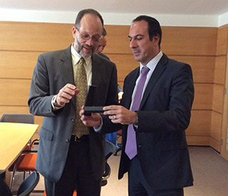 Secretary General of the Caribbean Community receives a gift from Executive Director of the Chilean International Cooperation Agency AGCI Jorge Daccarett after working session in Santiago on Monday.