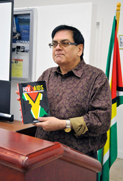 Professor Prem Misir presenting his book at the Consulate of Guyana, NY. Photo by Tangerine Clarke