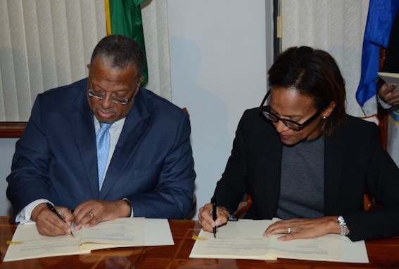 Above: Finance and Planning Minister, Dr Peter Phillips (left), and Inter-American Development Bank (IDB) Country Representative for Jamaica, Therese Turner-Jones