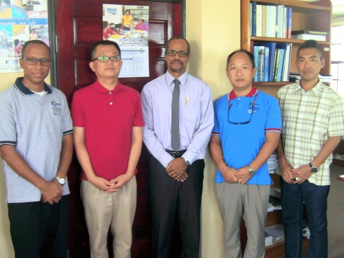 Mikhail Francis, Administrative Assistant for the CARIFICO project; Masaru Honda, Chief Advisor in the Department of Fisheries in St. Lucia; Milton Haughton, CRFM Executive Director; Mitsujiro Ishida, Marine Biologist, based at the Fisheries Division