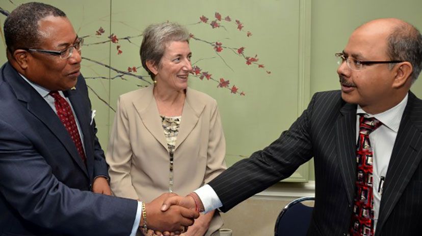 Minister of Industry, Investment and Commerce, Anthony Hylton (left), greets Resident Representative of the International Finance Corporation (IFC), Rajeev Gopal, at the launch of the &lsquo;Economic Partnership Agreement (EPA) Support to Jamaican Fo