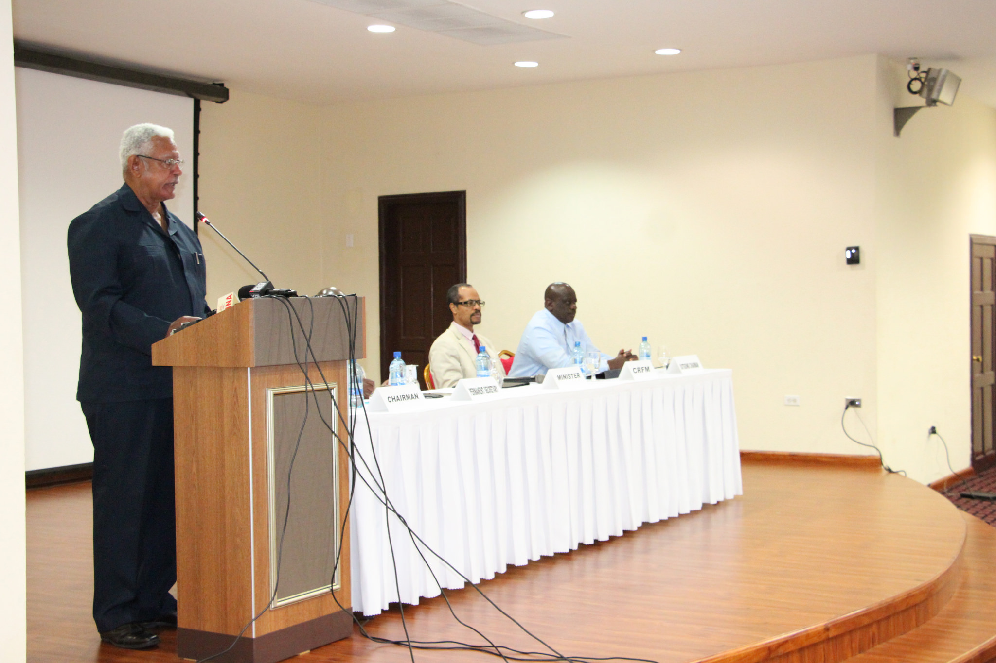 Hon. Noel Holder, Minister of Agriculture, Guyana, delivering the feature address, also in frame are Mr. Milton Haughton, Executive Director, CRFM Secretariat and Mr. Justin Rennie, Outgoing Chairman, Caribbean Fisheries Forum