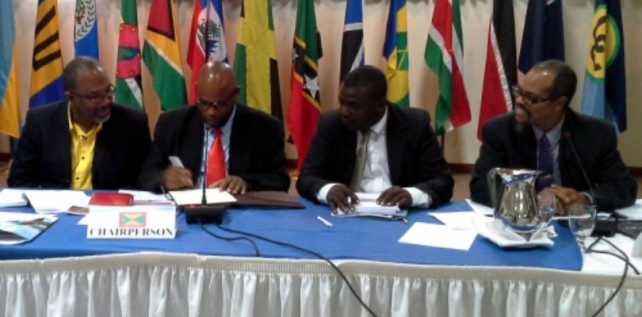 Signing (l to r): Luther Buchanan of Jamaica, Roland Bhola of Grenada, Johnson Drigo of Dominica and CRFM Executive Director Milton Haughton