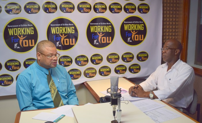 Host Lesroy Williams and Vincent Fough, Consumer Affairs Officer (Photo via SKNIS)