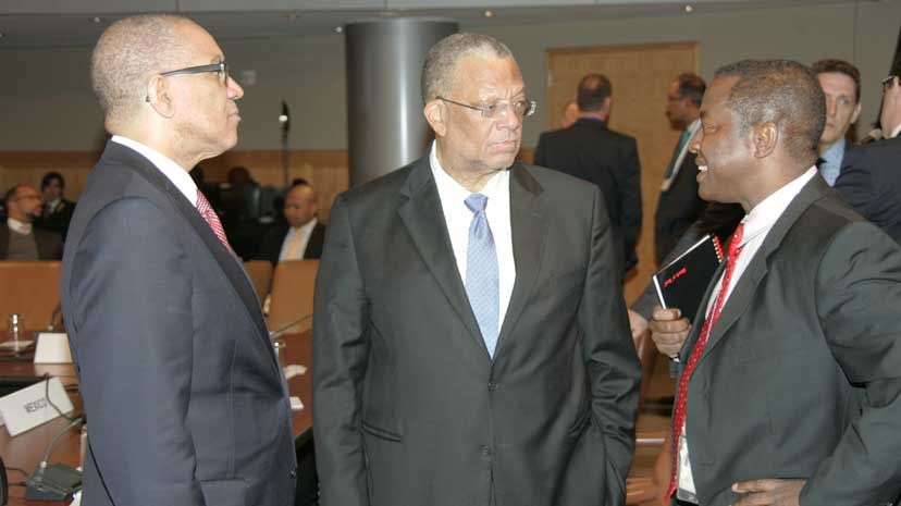 Minister of Finance and Planning, Dr the Hon. Peter Phillips engages in discussion with Assistant Director for the Caribbean Division Western Hemisphere Development, at the International Monetary Fund (IMF) (right), prior to the meeting of the first