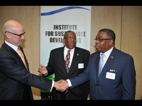 WI Pro Vice Chancellor Dr. Dale Webber (center); Minister Liburd (right) greets Bruno Pouezat, UN Resident Coordinator/United Nations Development Programme Resident Representative