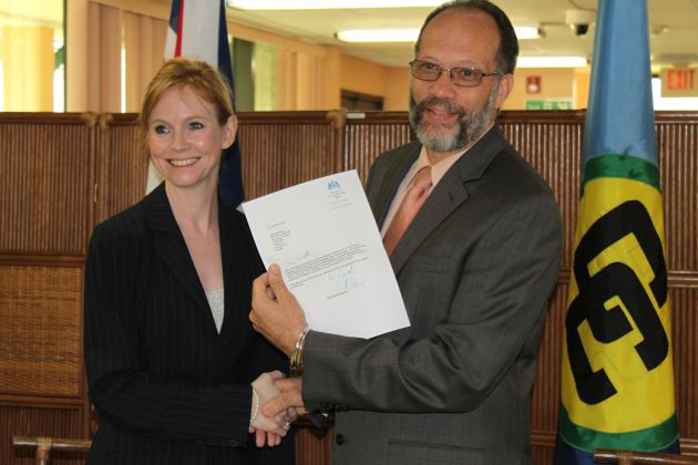 Ambassador Irwin LaRocque (R), CARICOM Secretary-General, accepts the Letters of Introduction from H.E. Victoria Dean (L), United Kingdom Ambassador to CARICOM, on Wednesday 19 March 2014 at the CARICOM Secretariat Headquarters, Georgetown, Guyana.