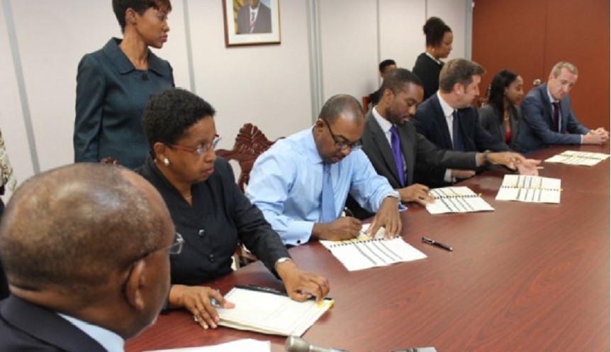 Representatives of Cable and Wireless (Barbados) Limited; Digicel (Barbados) Limited; and Columbus Barbados signing the MOU