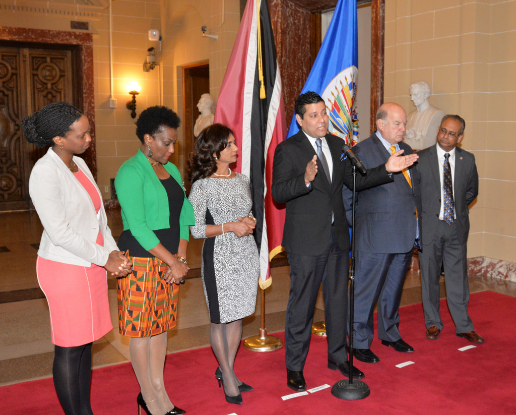 Permanent Representative of Trinidad and Tobago to the Organization of American States (OAS), Neil Parsan speaks in the presence of OAS Secretary-General, Jose Miguel INsulza (Second from right), Assistant Secretary-General ALbert Ramdin, and CARICOM