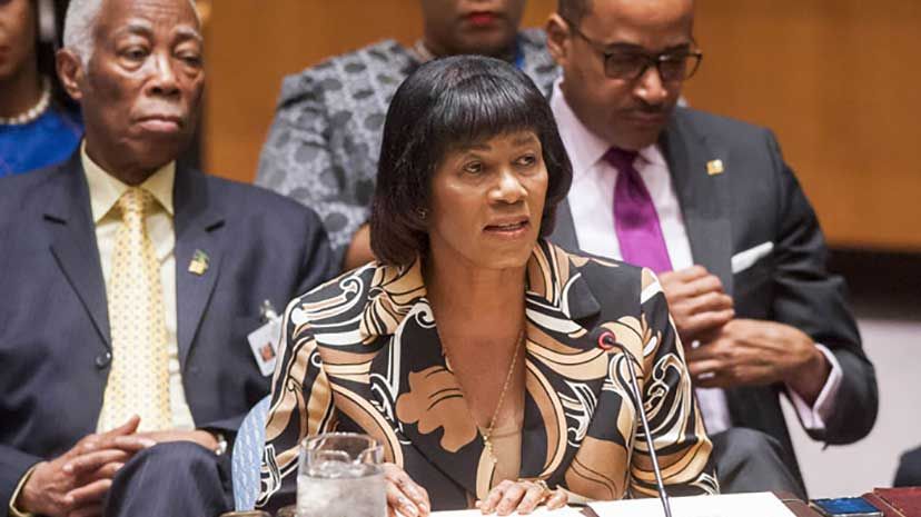 Prime Minister Portia Simpson Miller addresses the United Nations Security Council and the UN Headquarters in New York on Thursday, July 30. In the background at left is Minister of Foreign Affairs and Foreign Trade, Senator the Hon. AJ Nicholson QC,