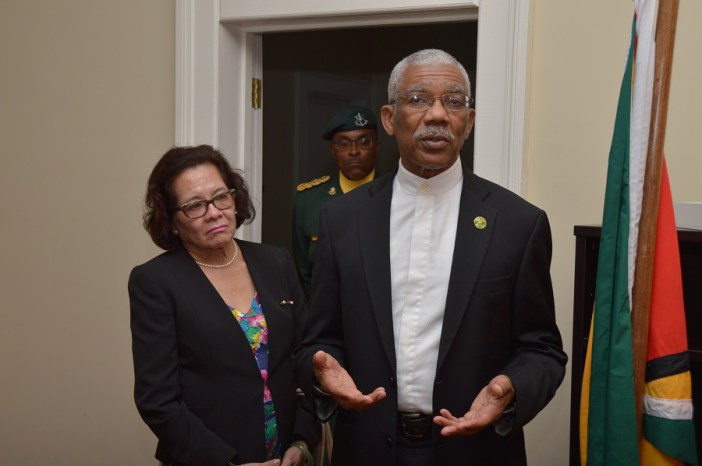 President David Granger addressing the staff of Guyana&rsquo;s Consulate in Barbados as First Lady. Mrs. Sandra Granger listens intently (Photo via Ministry of the Presidency)