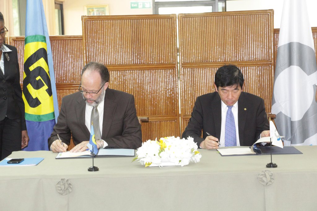 CARICOM Secretary-General, Ambassador Irwin LaRocque and World Customs Organisations Secretary-General, Kunio Mikuriya sign the Memorandum of Understanding