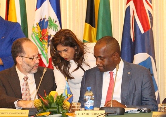 Chair of the Community, Prime Minster Roosevelt Skerrit of Dominica and CARICOM Secretary-General in discussion with a delegate before the start of the plenary sessions on Tuesday morning