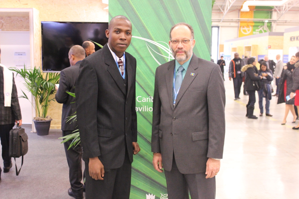 CARICOM Secretary-General, Ambassador Irwin LaRocque (r) and Caribbean Youth Environment Network’s Special Envoy Mr. Stefan Knights meet outside the Caribbean Pavilion at COP 21, Paris France