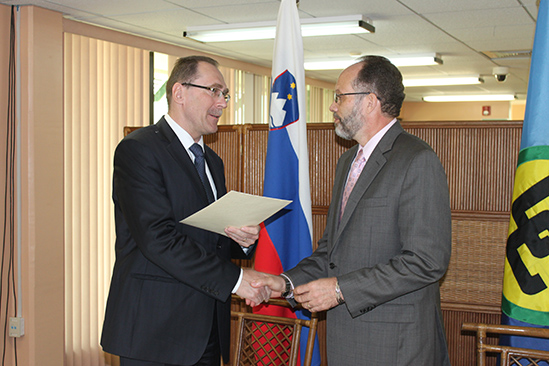 Newly appointed Ambassador from Slovenia to the CARICOM Secretariat His Excellency Dr. Bozo Cerar hands over his credentials to Secretary General of the Caribbean Community Ambassador Irwin LaRocque in a ceremony at the Secretariat on Friday.