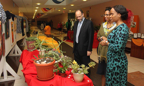 Secretary-General Irwin LaRocque, Chef de Cabinet Ms Glenda Itiaba and Ms Anya Thomas of the Sustainable Development department, look at an exhibit during the opening of the 2013 CARICOM Staff Talent week on Monday.