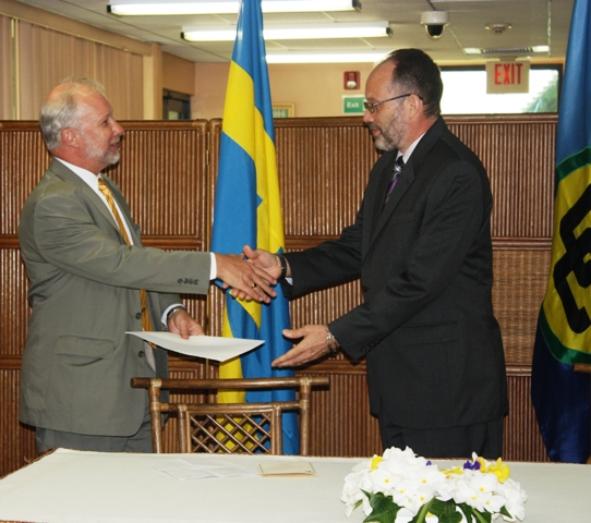 Ambassador Irwin LaRocque (R), Secretary-General of the Caribbean Community accepts the Letters of Credence of the first Plenipotentiary Representative of Sweden to CARICOM, His Excellency Claes Hammar, on Friday 11 April, 2014, at the Georgetown, Gu