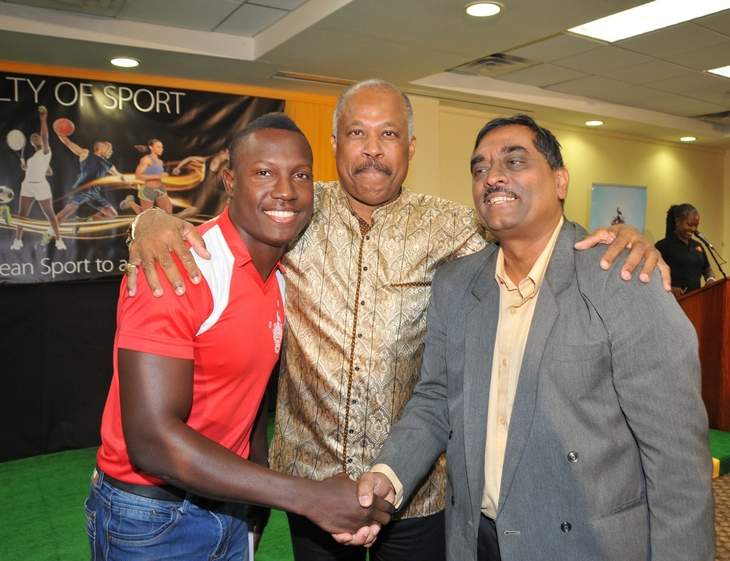 COMBINING FORCES: West Indies cricketer, Rovman Powell, left, The University of the West Indies Vice-Chancellor, Professor Sir Hilary Beckles, centre, and Dean of the Faculty of Sport, Dr Akshai Mansingh share a light moment at the official launch of