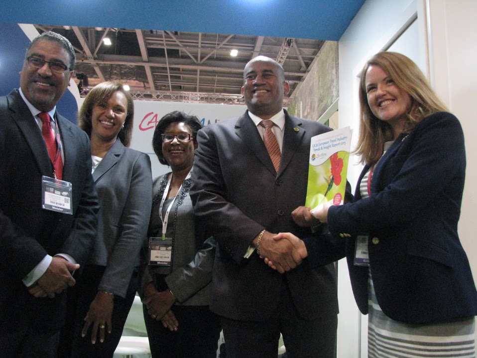 Pippa Jacks (R) of Travel Trade Gazettes presents a copy of CTO UK Travel Industry Trends & Insights Report 2015 to CTO chairman Richard Sealy, Minister of Tourism of Barbados. Also in photo, from left, are, Jamaica’s Minister of Tourism Wy
