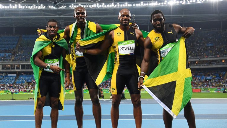 Yohan Blake, Usain Bolt, Asafa Powell and Nickel Ashmeade celebrate after 4x100m relay final
