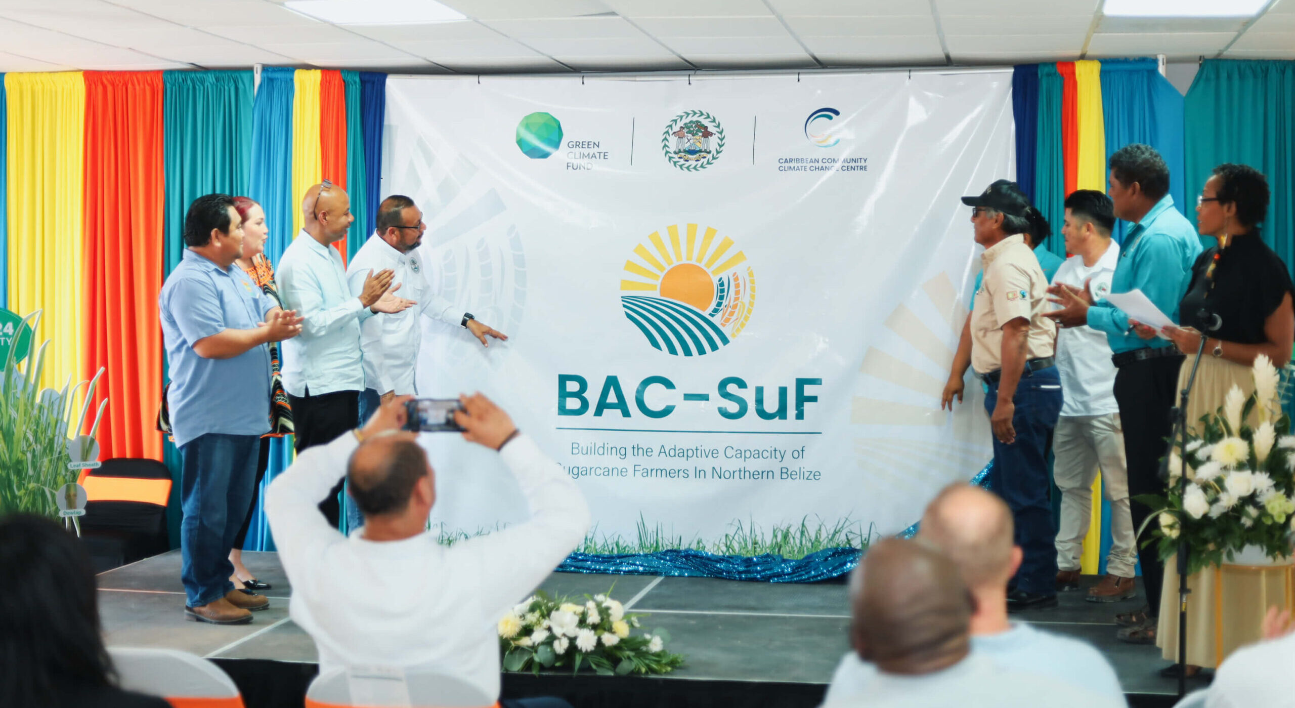 CCCCC, Belize event - officials and banner