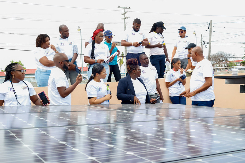 CEm Tours - students outside with Ian Cole