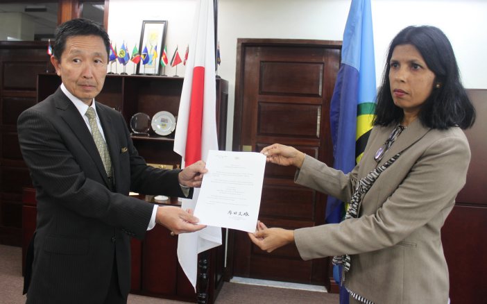 Plenipotentiary Representative of Japan to the Caribbean Community (CARICOM), His Excellency Mitsuhiko Okada and Deputy Secretary-General of CARICOM, Ambassador Manorma Soeknandan (PhD), display his credentials on Thursday, 25 February, 2016, at the