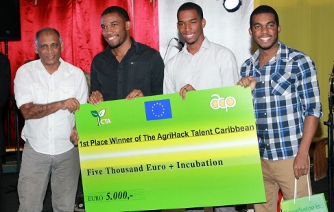 Guyana's Minister of Health, Dr, Leslie Ramsammy (left) with the first place winners of AgriHack Talent Caribbean contest