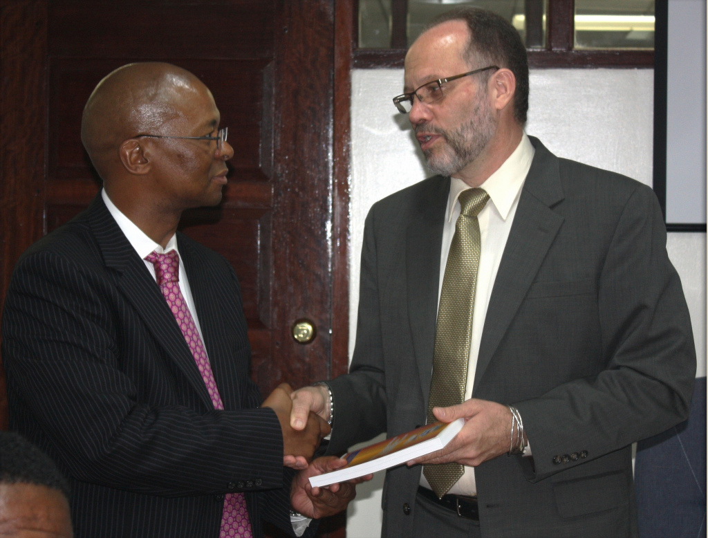 CARICOM Secretary-General, Ambassador Irwin LaRocque (right) presents a copy of the Revised Treaty of Chaguaramas to Ambassador Baso Sanqu (left), Chief Adviser to the Chairperson of the African Union Commission, during a courtesy call at the CARICOM