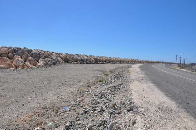 Huge boulders have been used to protect Jamaica's Palisadoes road which connects Port Royal and the Norman Manley International Airport. The road was previously blocked by storm surges. Credit: Desmond Brown/IPS