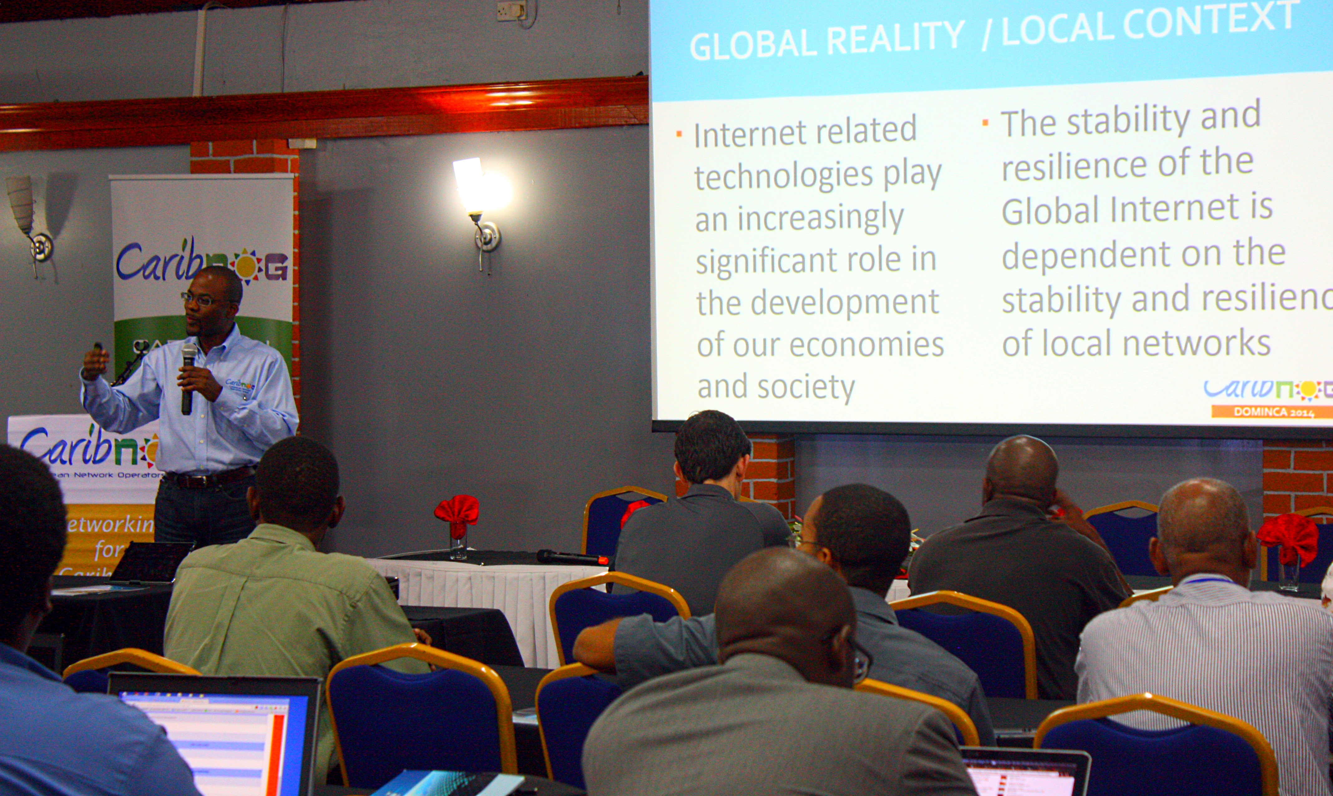 Bevil Wooding, left, one of the founders of CaribNOG, leads a session at the seventh installment of the regional technology development event, held in Roseau, Dominica from April 28 to May 2, 2014. Photo courtesy CaribNOG.