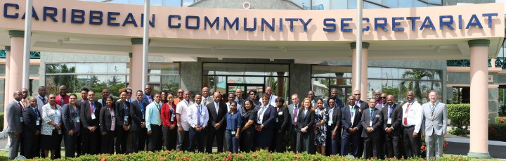 Delegates and facilitators pause for a photo op after the opening ceremony of the Workshop at the CARICOM Secretariat Tuesday morning
