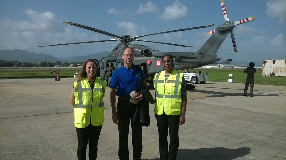 Dr. C James Hospedales, Executive Director of CARPHA accompanied by two Officers from the Agency