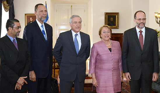 Secretary General of the Caribbean Community Ambassador Irwin LaRocque(right)  poses with Chilean President Her Excellency Michelle Bachelet and Chilean Foreign Minister Heraldo Munoz at the end of discussions at the President's Office  in Santi