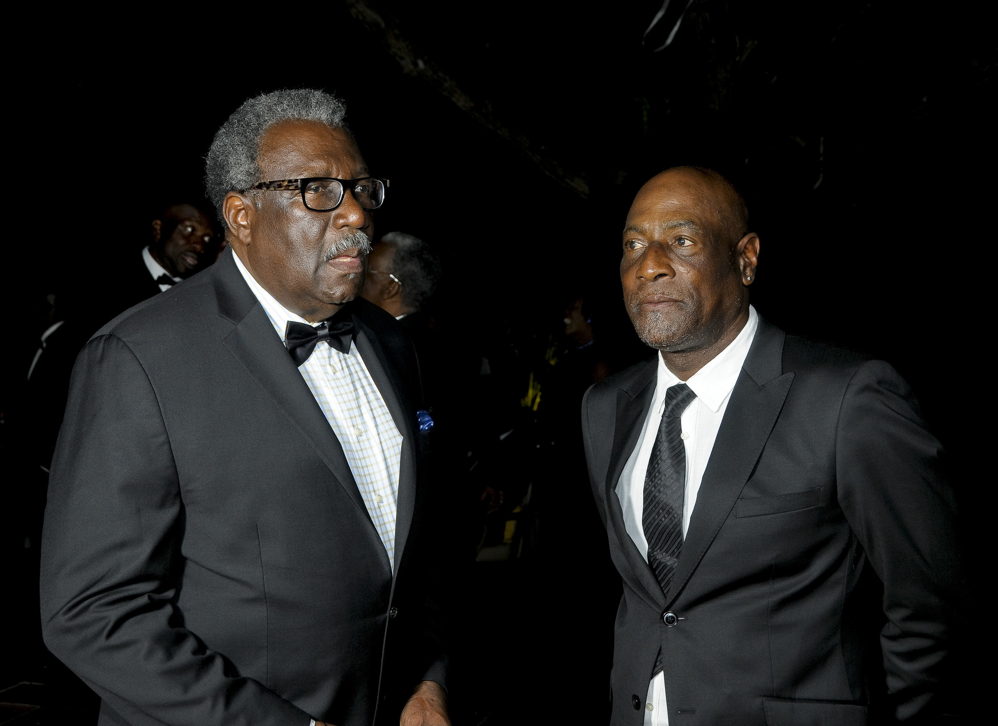 Clive Lloyd (left) speaks with Sir Vivian Richards during the back-tie dinner. (Photo courtesy WICB Media)