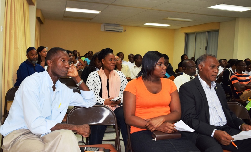 Senior Minister Amory ( front row, right), listens attentively as presenters engage audience in an interactive session on the  the CARICOM Skills Certificate