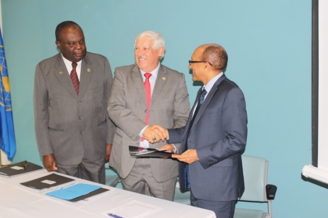 Second from left: IICA's Director General, Victor M. Villalobos and the Director of CTA, Michael Hailu shake hands after signing their agreement. Looking on is CARDI's Executive Director, Barton Clarke (extreme left).