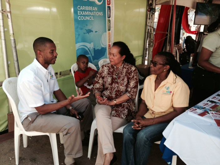 CXC Assistant Registrar Public Information and Customer Service, Mr. Cleveland Sam, elaborates on the new CAPE syllabuses to Deputy Progamme Manager, Culture at the CARICOM Secretariat Ms. Riane DeHaas Bledeog and Dr. Annette Piper, CXC Assistant Reg