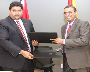 Trinidad and Tobago&rsquo;s Minister of Energy and Energy Affairs, Sen. the Hon. Kevin Ramnarine, and Guyana&rsquo;s Minister of Natural Resources and the Environment, the Hon. Robert Persaud at the signing of the MoU on Cooperation in Energy related