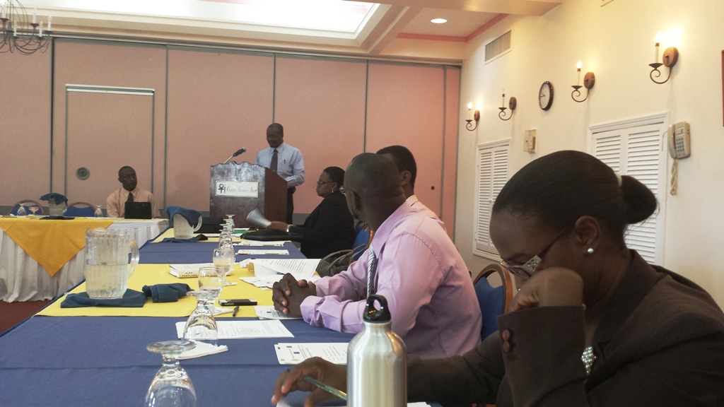 Participants at the Global Climate Change launch, being addressed by Mr. Randolph Edmeade, Director of Physical Planning and Environment