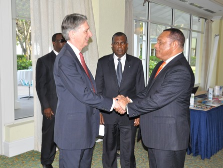 At the the opening ceremony for the 9th UK-Caribbean Forum, April 29 at the Grand Lucayan in Freeport, Prime Minister of The Bahamas the Rt. Hon. Perry Christie (right) greets United Kingdom Secretary of State for Foreign and Commonwealth Affairs the