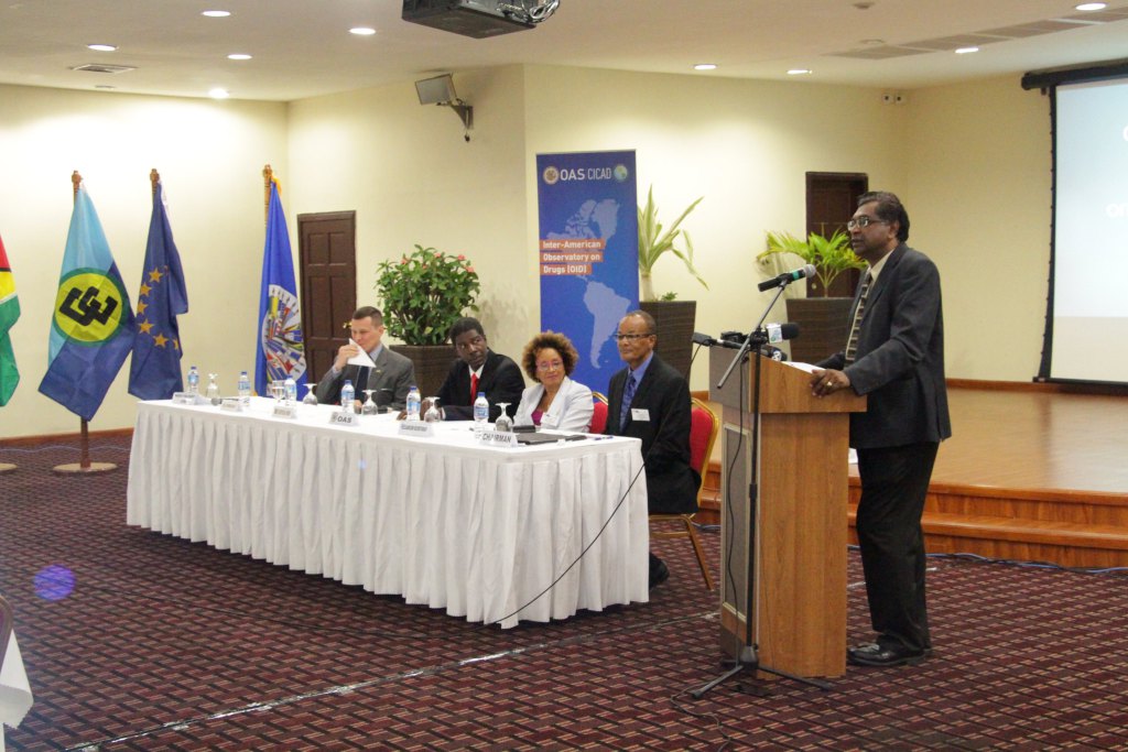 Minister Khemraj Ramjattan at the podium. Also in photograph are, from left, Mr. Terry Steers-Gonzalez, Charg&eacute; d' Affaires, US Embassy in Guyana; Mr Jean-Ricot Dormeus, OAS/CICAD Representative to Guyana; Ms. Beverly Reynolds, Coordinator