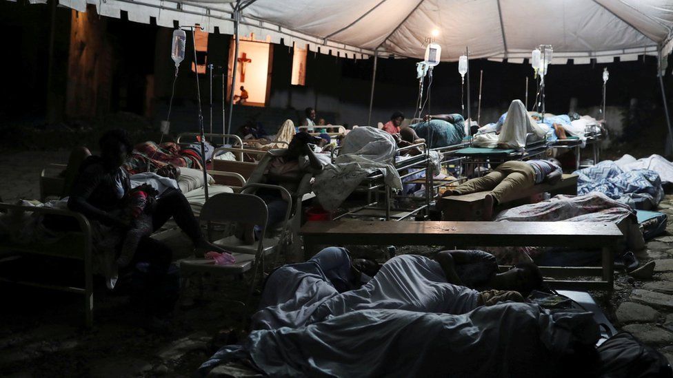 The injured sleep in a tent near Port-de-Paix, Haiti (Photo by Reuters via BBC)