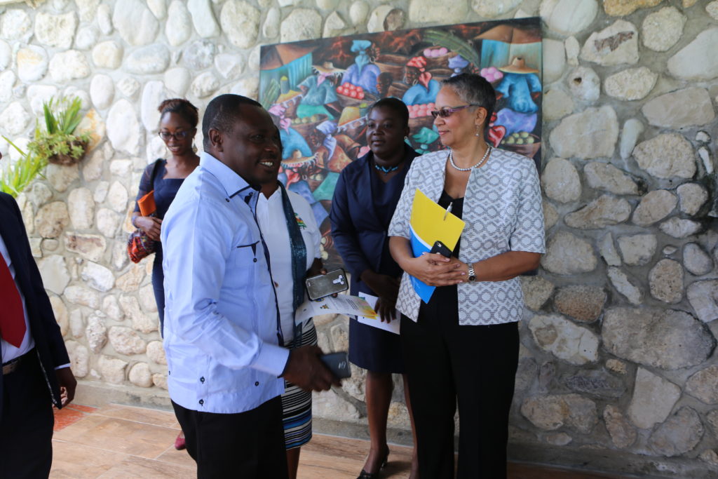 H.E. Pierre Simon Georges, Minister of Environment, Haiti (left) and Monica La Bennett, Vice-President (Operations), CDB (right), discuss how the project will positively impact the lives of Ile-&agrave;-Vache's residents. (Photo via CDB)
