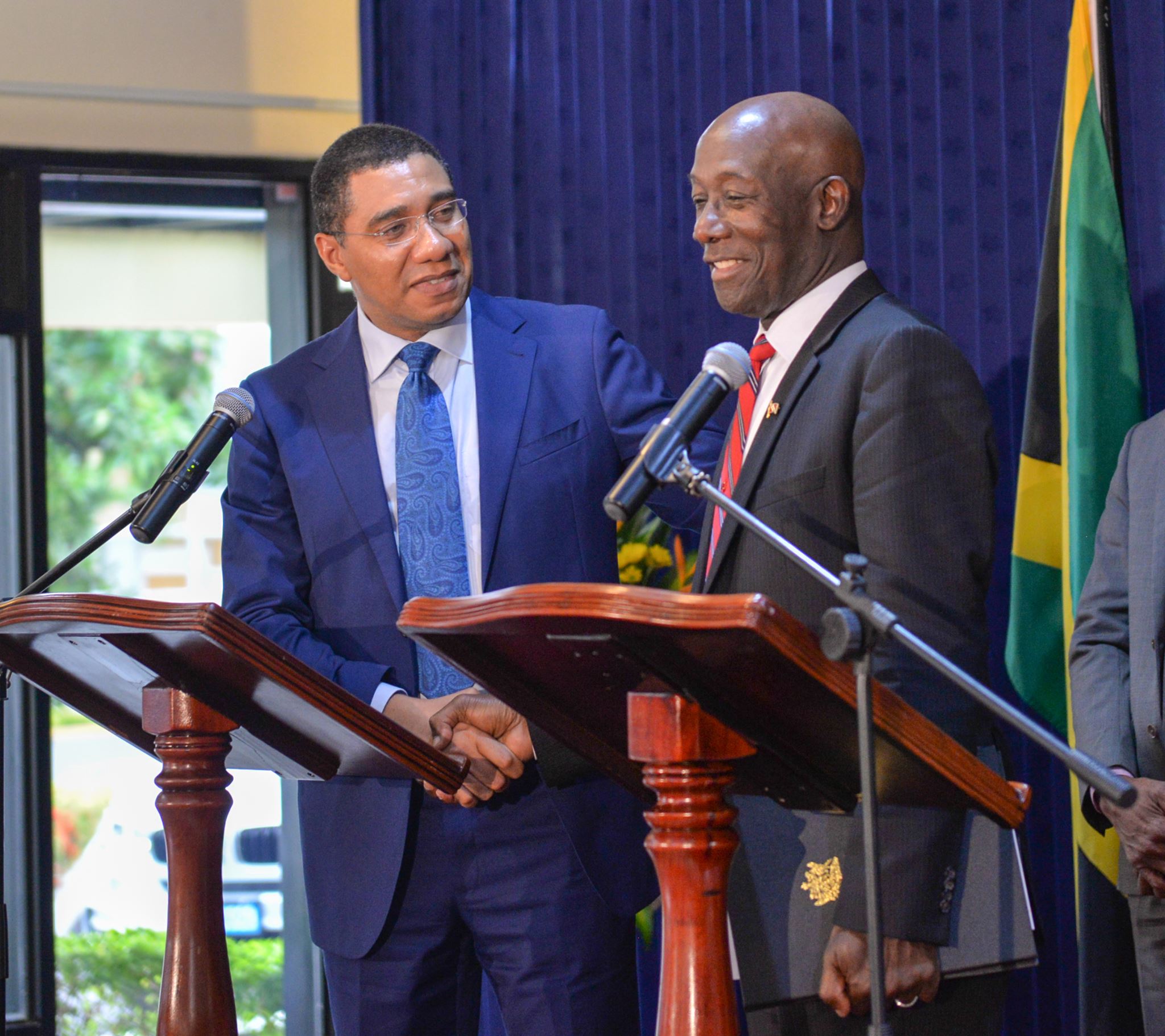 Jamaica&rsquo;s Prime Minister Andrew Holness (left) and his Trinidad and Tobago counterpart Dr. Keith Rowley at their joint press conference in Kingston on Monday.