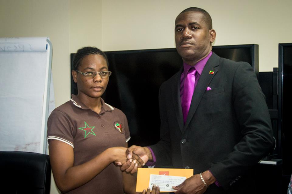 Hon. Shawn Richards presents cheque to Kristal Phillip
